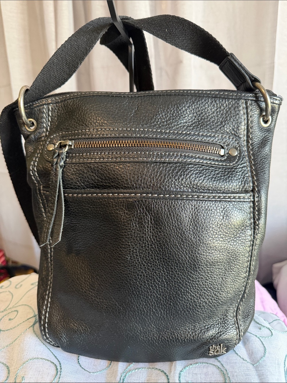 The Sak Black Pebbled Leather Messenger Bag with Fabric Strap